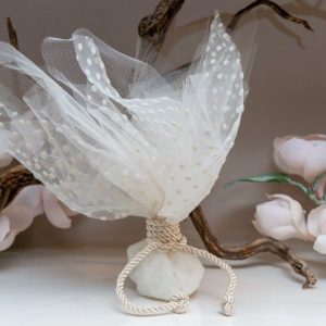Wedding favor with ivory tulle and polka dots and tying with ivory cord